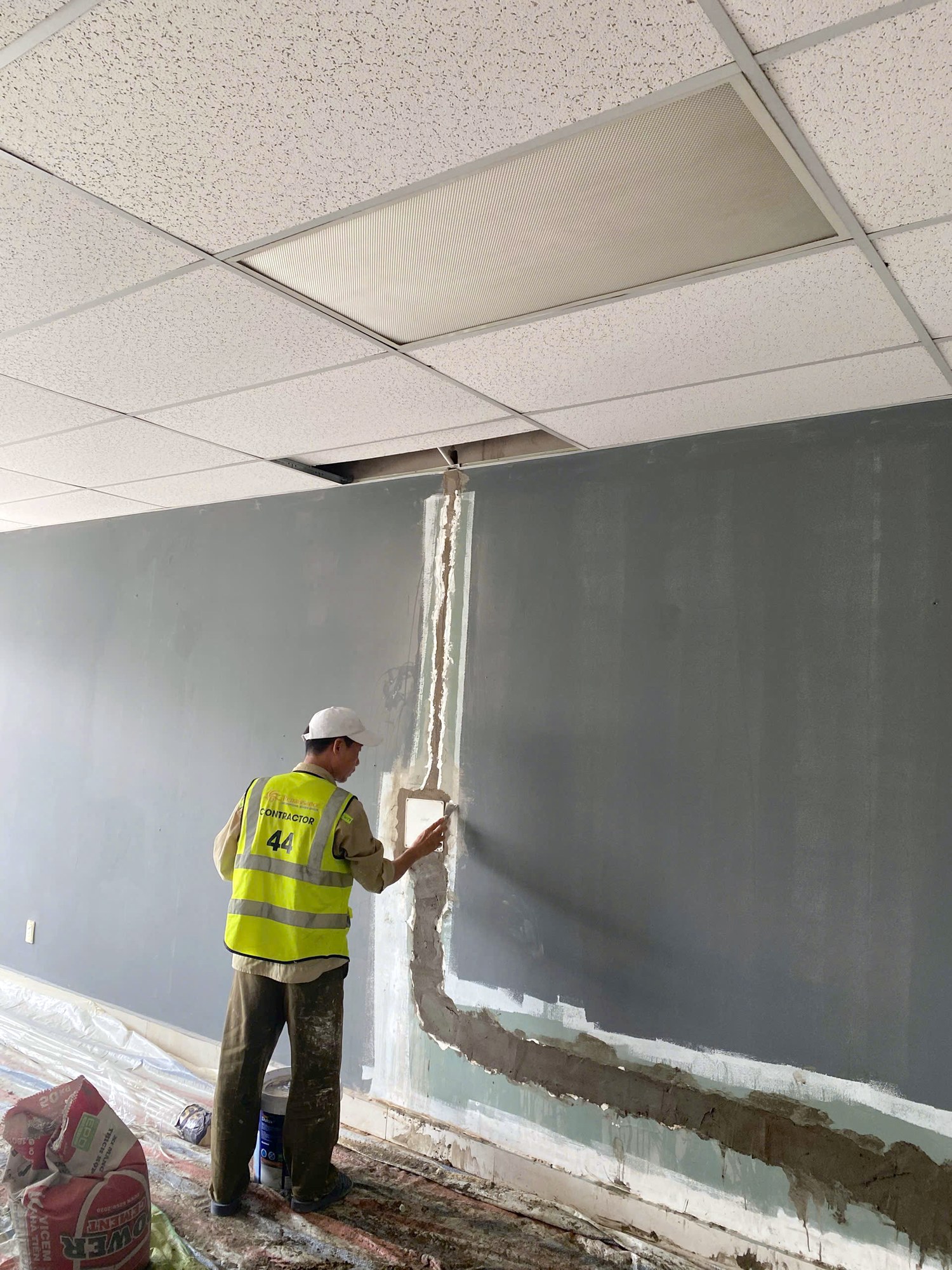 Recessed electrical outlet made good after filling